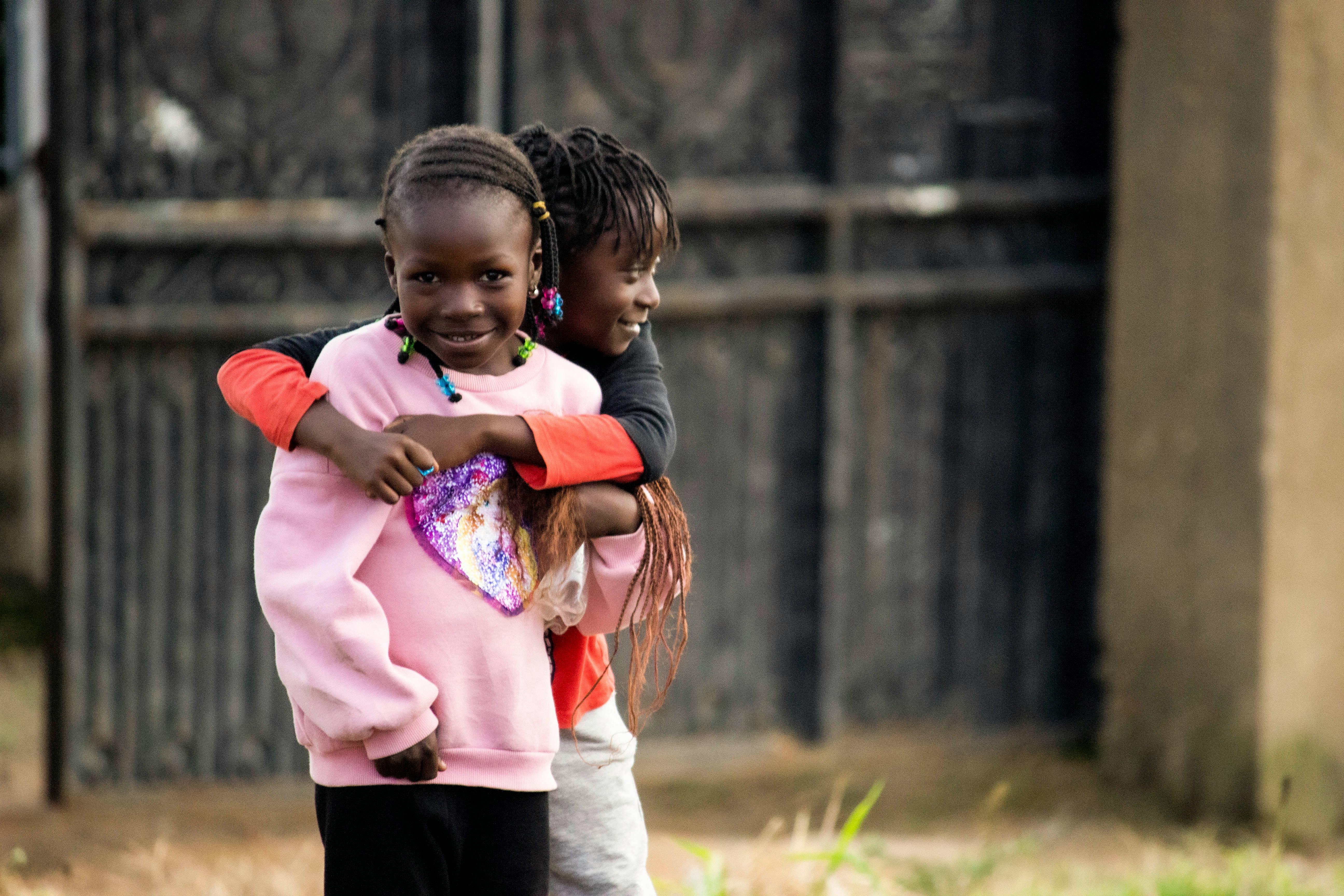 Children embracing joyfully