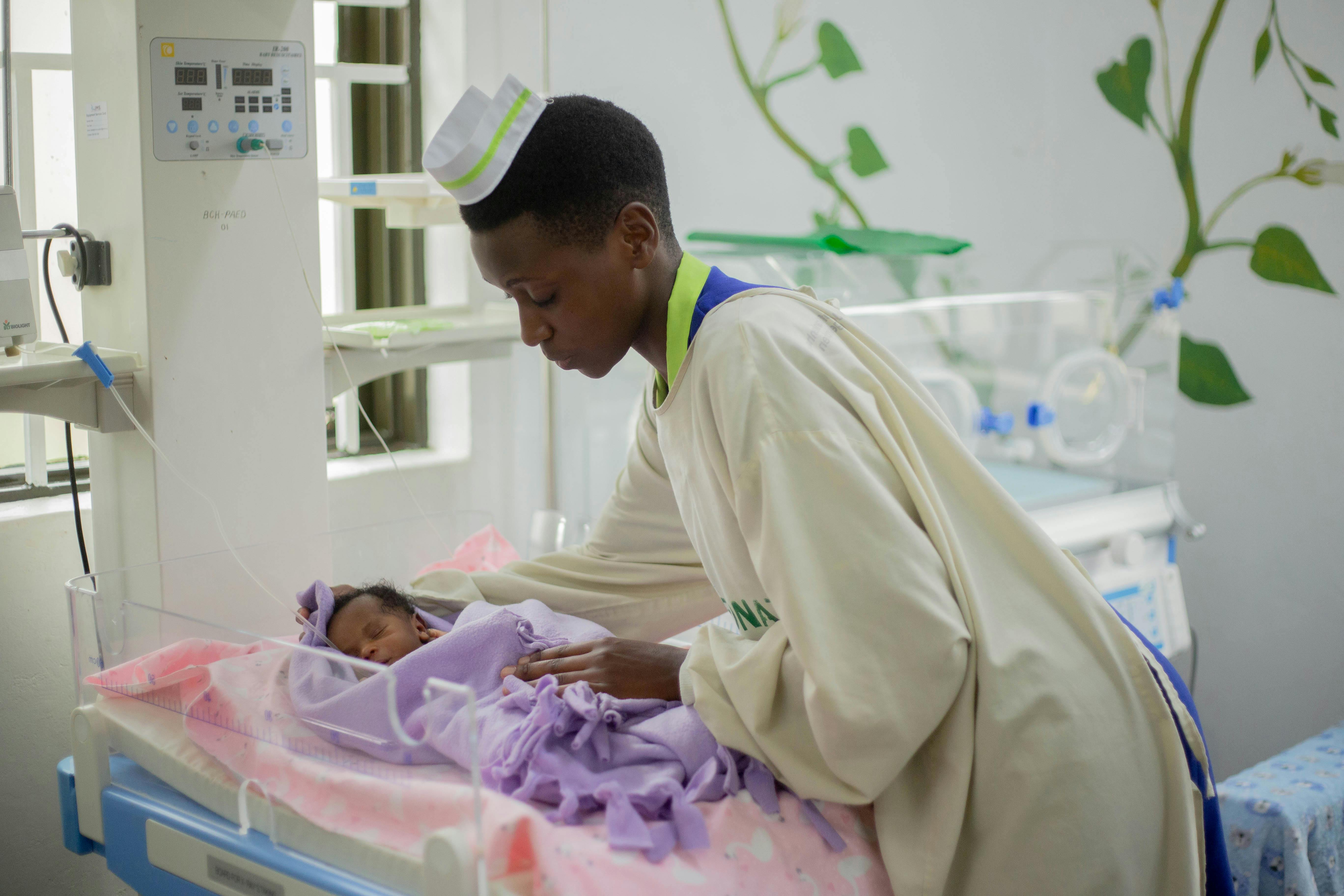 Nurse caring for newborn